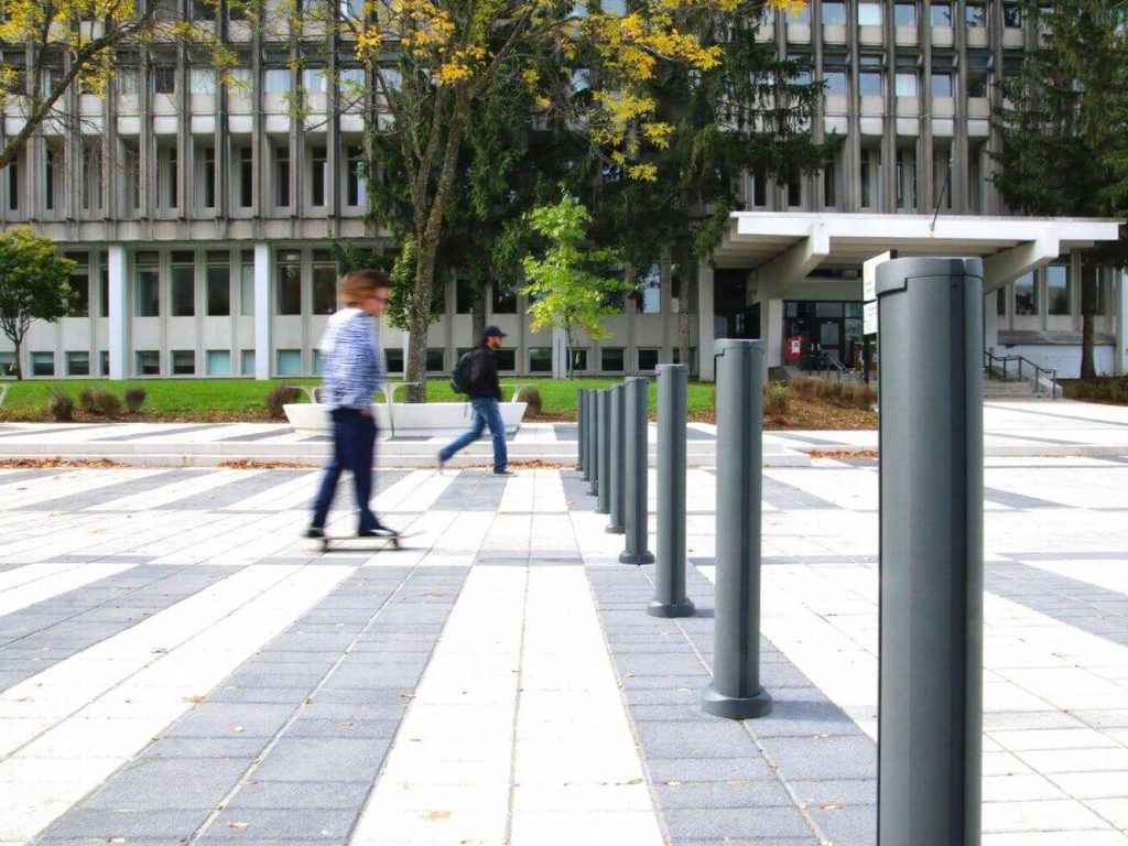 Bollards outside Laval University with man walking
